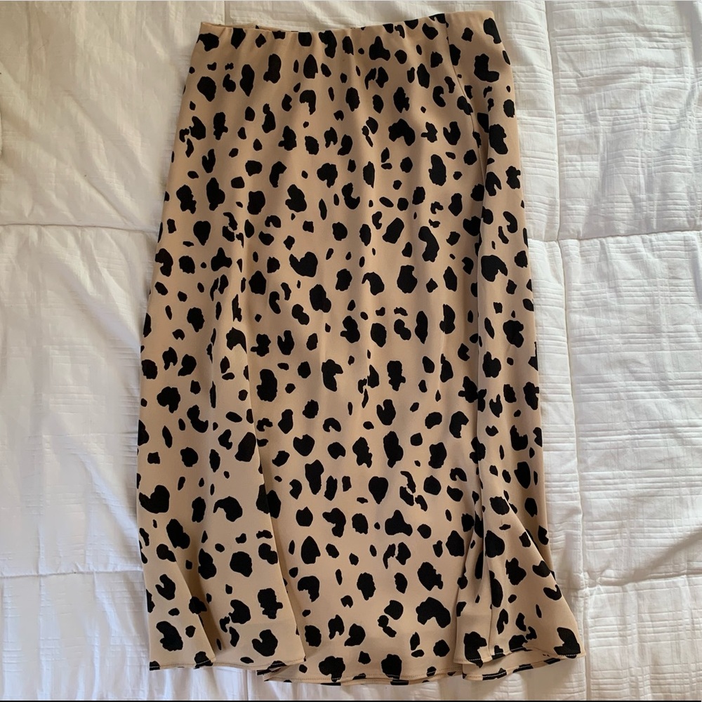 Adorable animal print skirt. In great shape. Tiny tear on the waistband.